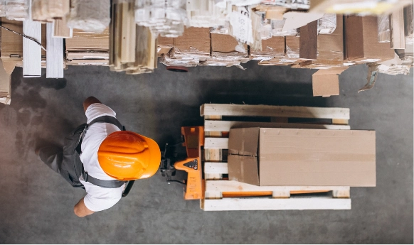 warehouse worker transporting boxes